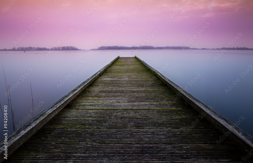 Serene color image of a jetty in a lake 