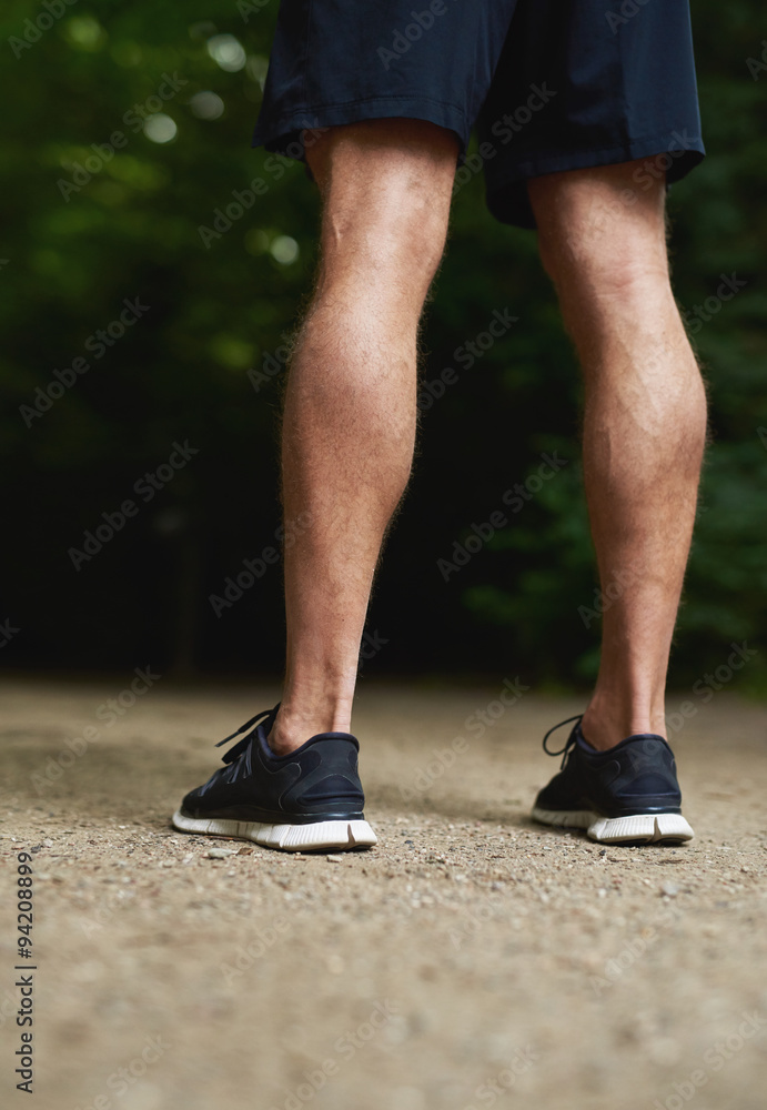 Legs of a fit muscular athletic man