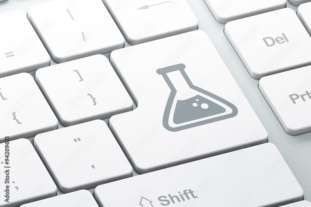 Science concept: Flask on computer keyboard background Science concept: Flask on computer keyboard background