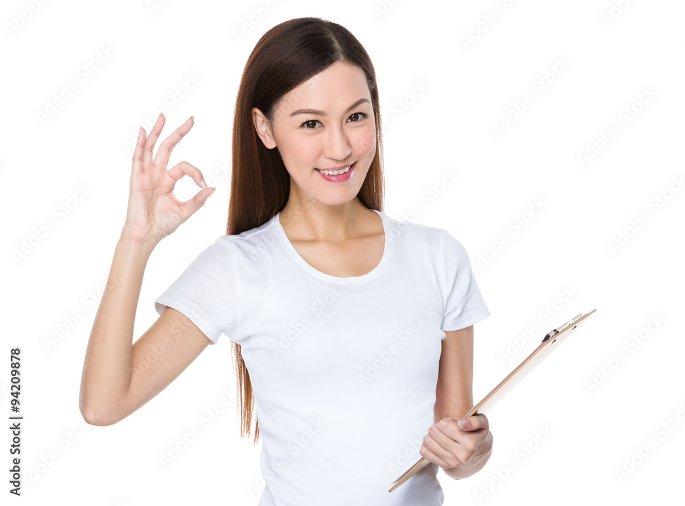 Asian Young Woman hold with clipboard and ok sign gesture Asian Young Woman hold with clipboard and ok sign gesture