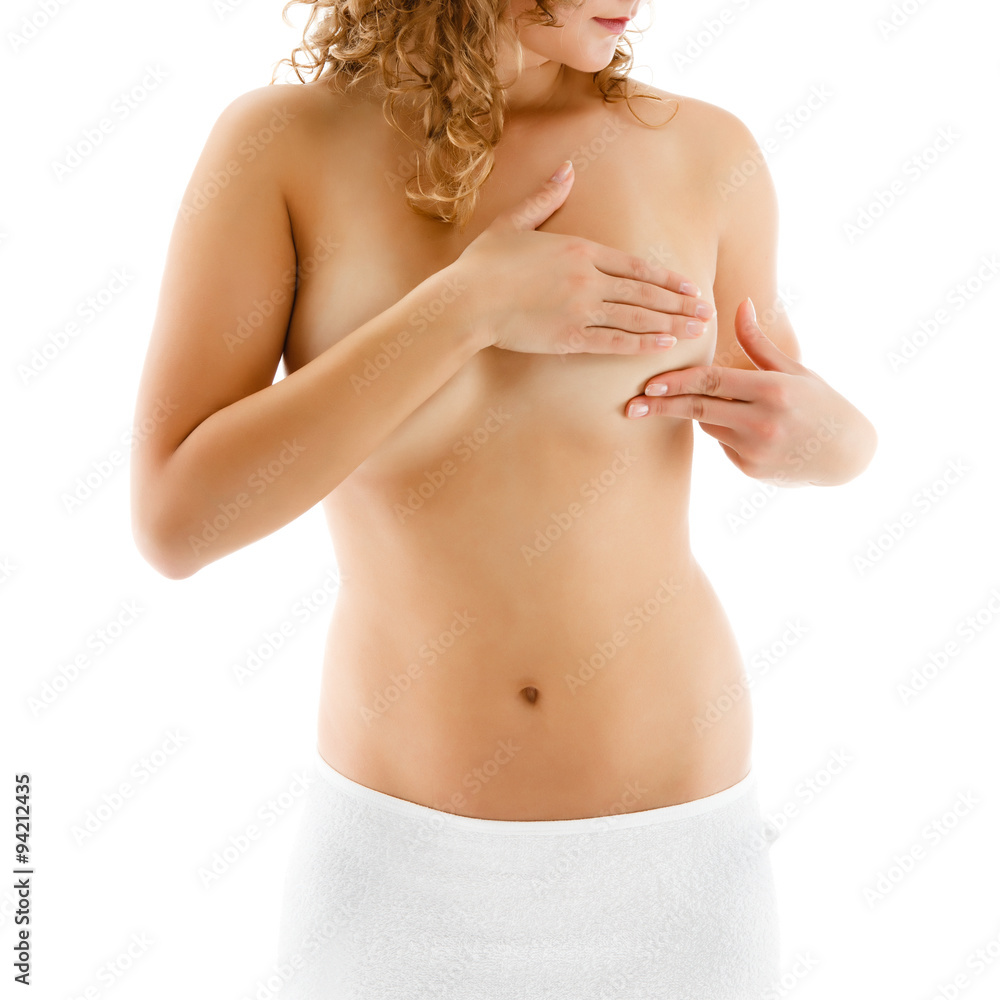 Fototapeta premium Woman examining her breast isolated on white background