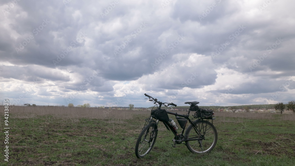 Bicycle and field with sky. 4K (4096x2304) Time lapse without bird Bicycle and field with sky. 4K (4096x2304) Time lapse without bird