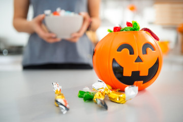 Closeup on halloween bucket full of trick or treat candy