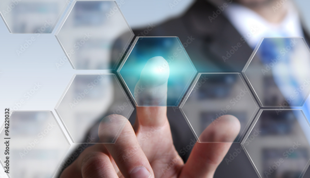 Businessman in his office using tactile interface Businessman in his office using tactile interface