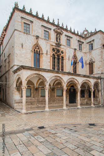      Sponza Palace in Dubrovnik with flag of Croatia and European Union. Sponza Palace was built in 16th century.  © ilijaa
