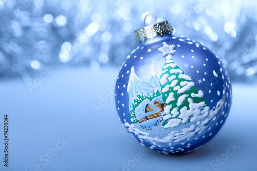 Christmas ball blue and white on blurred background new year