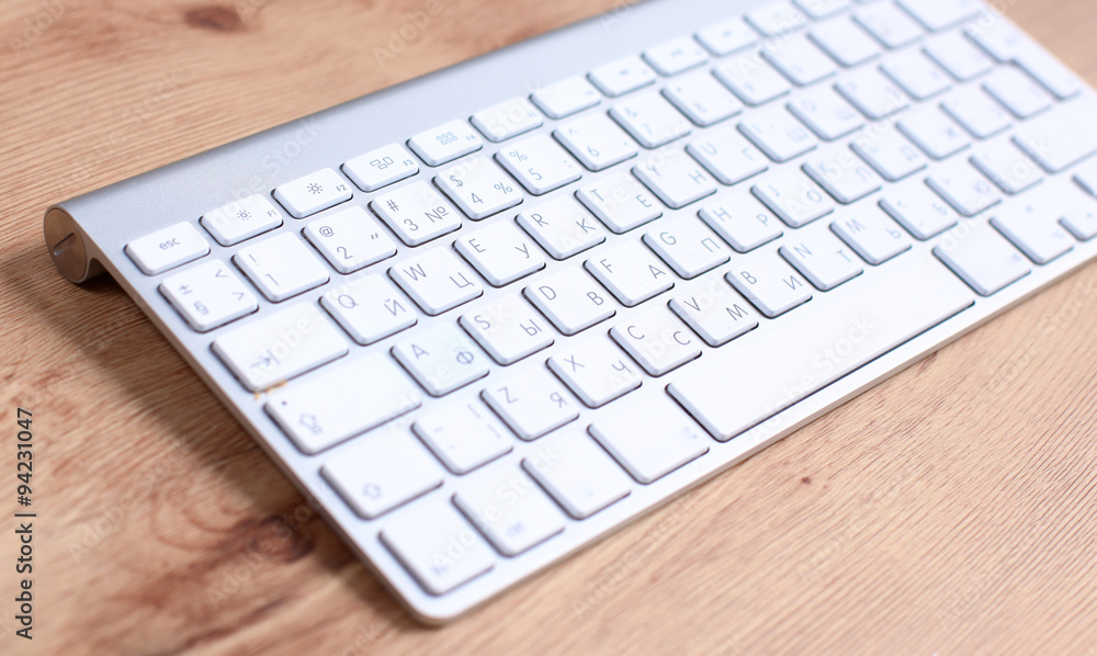 Modern aluminum computer keyboard on the table Modern aluminum computer keyboard on the table