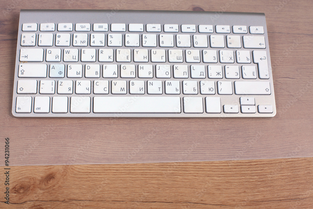 Modern aluminum computer keyboard on the table Modern aluminum computer keyboard on the table