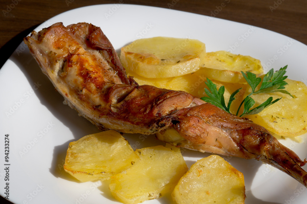 roast leg of rabbit with potatoes