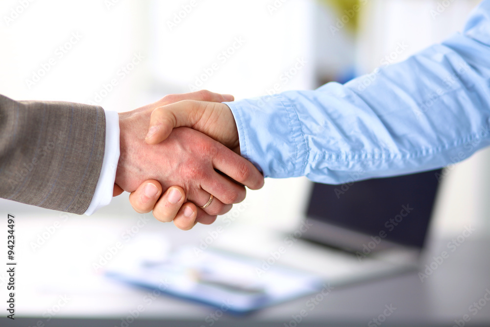 Business handshake. Two businessman shaking hands with each Business handshake. Two businessman shaking hands with each