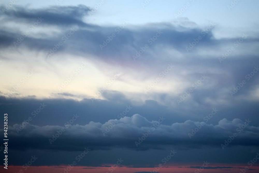 Evening white blue and red cloudy sky
