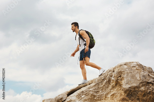 Young man tourist with a backpack