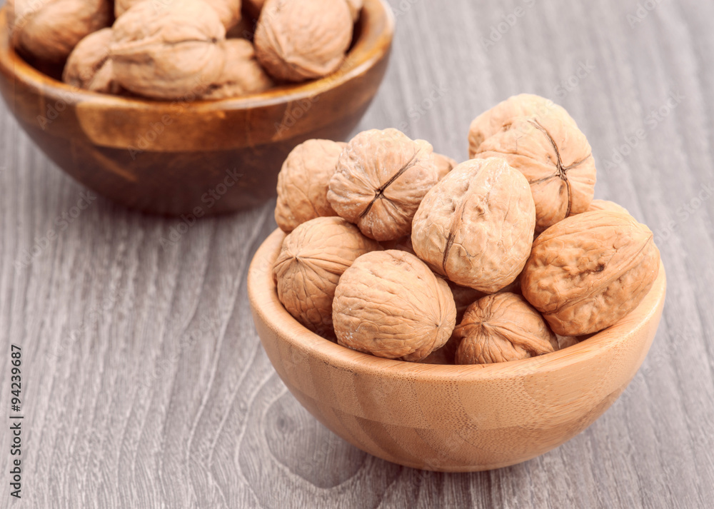 Walnuts on rustic wooden table Walnuts on rustic wooden table