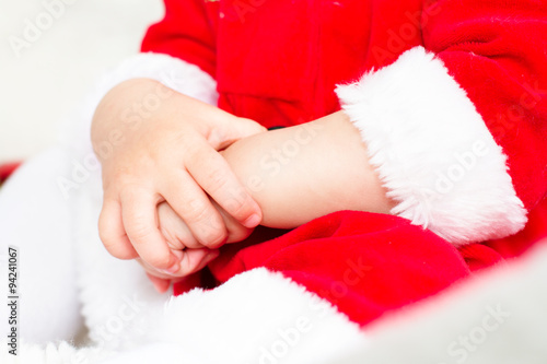 Christmas toddler hands close up on white background