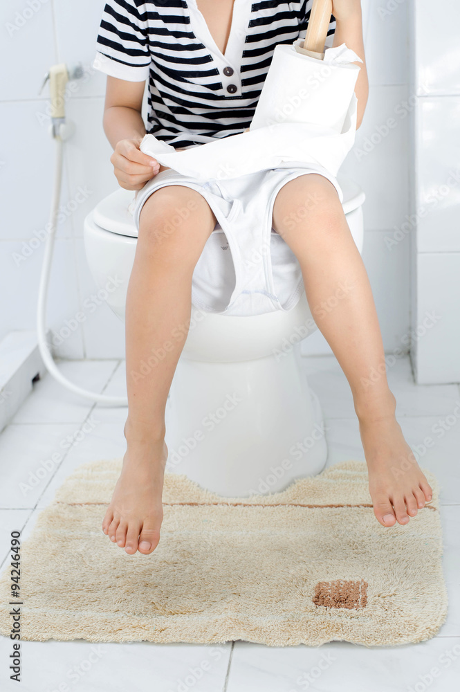 Boy using toilet Boy using toilet