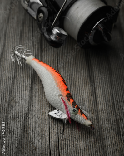 Bild auf Leinwand Fishing tackle squid lure on wooden background