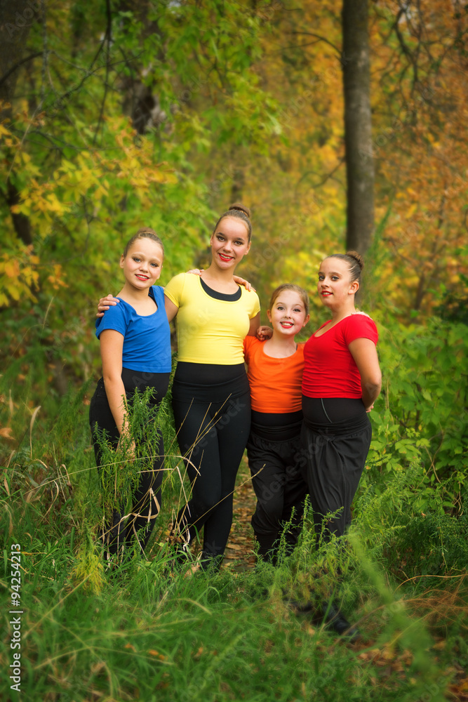 Young Girl Friends in the Forest in Autumn Young Girl Friends in the Forest in Autumn
