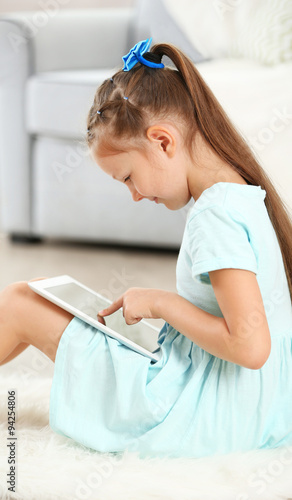 Little cute girl with digit...
