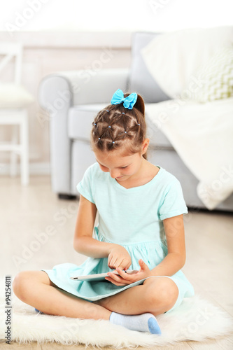 Little cute girl with digit...