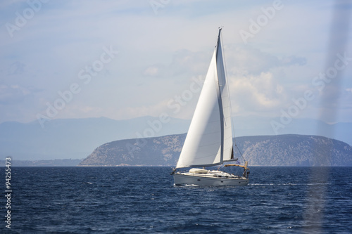Ship yacht with white sails in the Sea. Sailing yacht race.