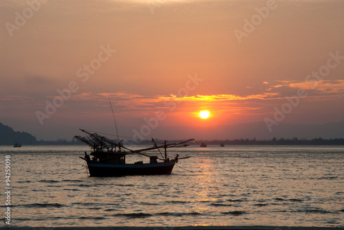 Fishermen boat at sunset in Thailand.