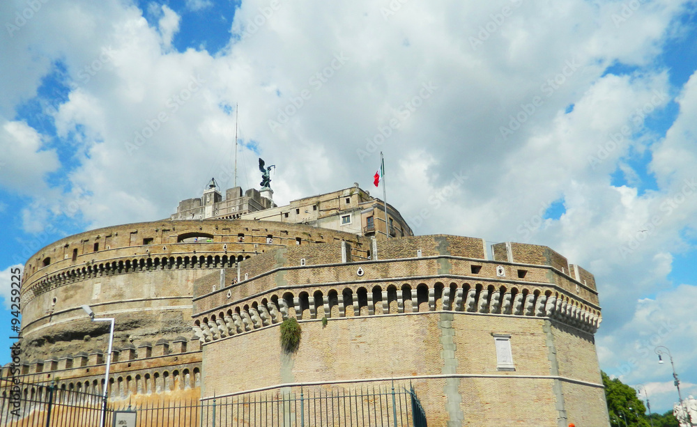 Castel Sant ' Angelo with angel statue and Italian flag. Castel Sant ' Angelo with angel statue and Italian flag.