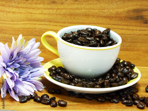 studio shot of coffee beans on wooden background still life