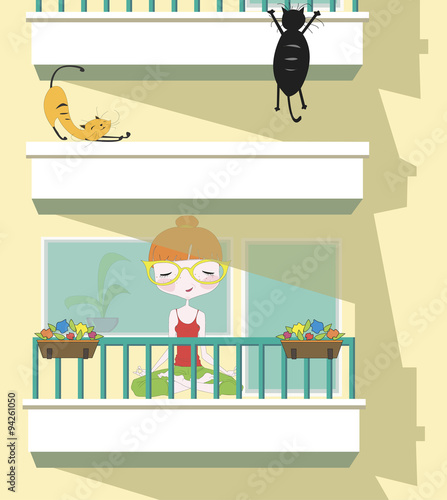 Girl making yoga on the balcony with cats