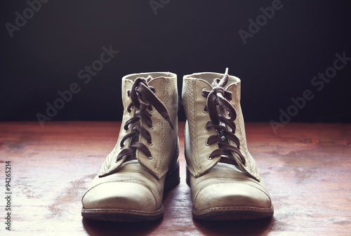 Brown leather shoes on wooden floor