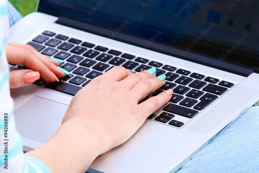 Business woman hands busy using laptop at office desk Business woman hands busy using laptop at office desk