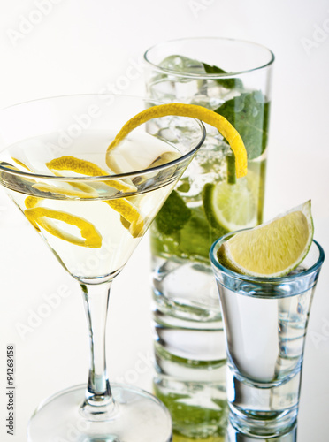Various cocktails and alcohol on white background