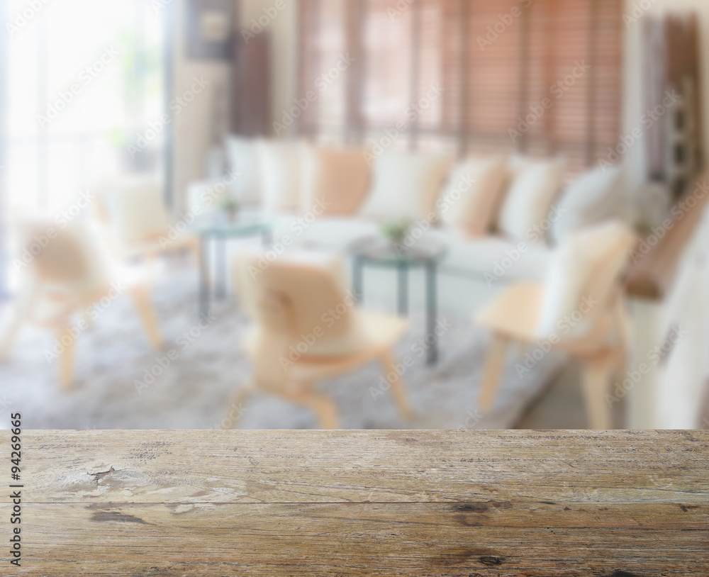 wooden table top with blur of modern living room interior as bac wooden table top with blur of modern living room interior as bac