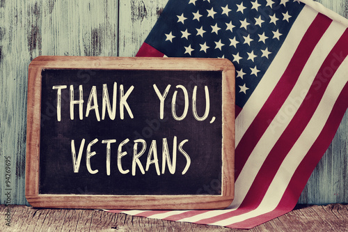 text thank you veterans in a chalkboard and the flag of the US photo