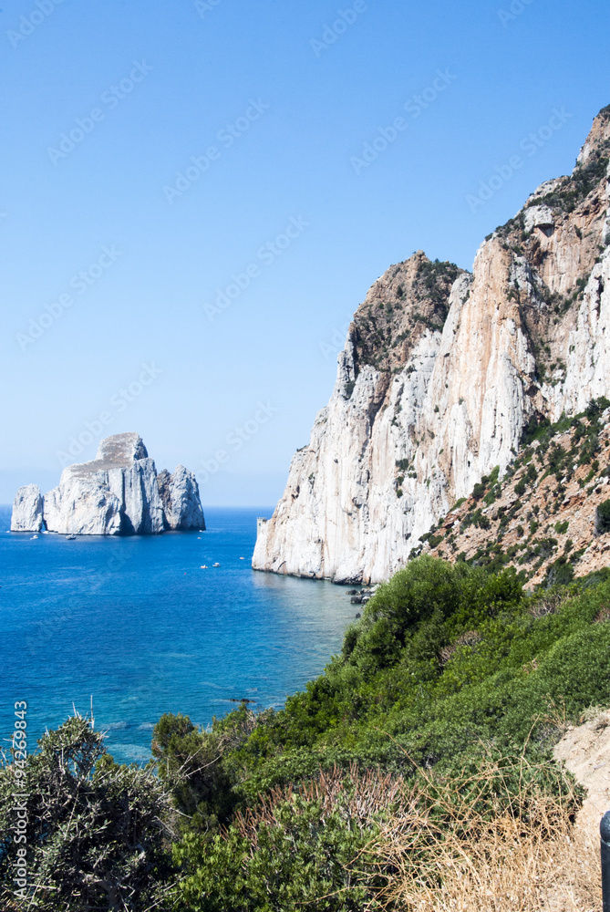 Pan di Zucchero rocks in the sea and Masua's sea stack (Nedida), Sardinia