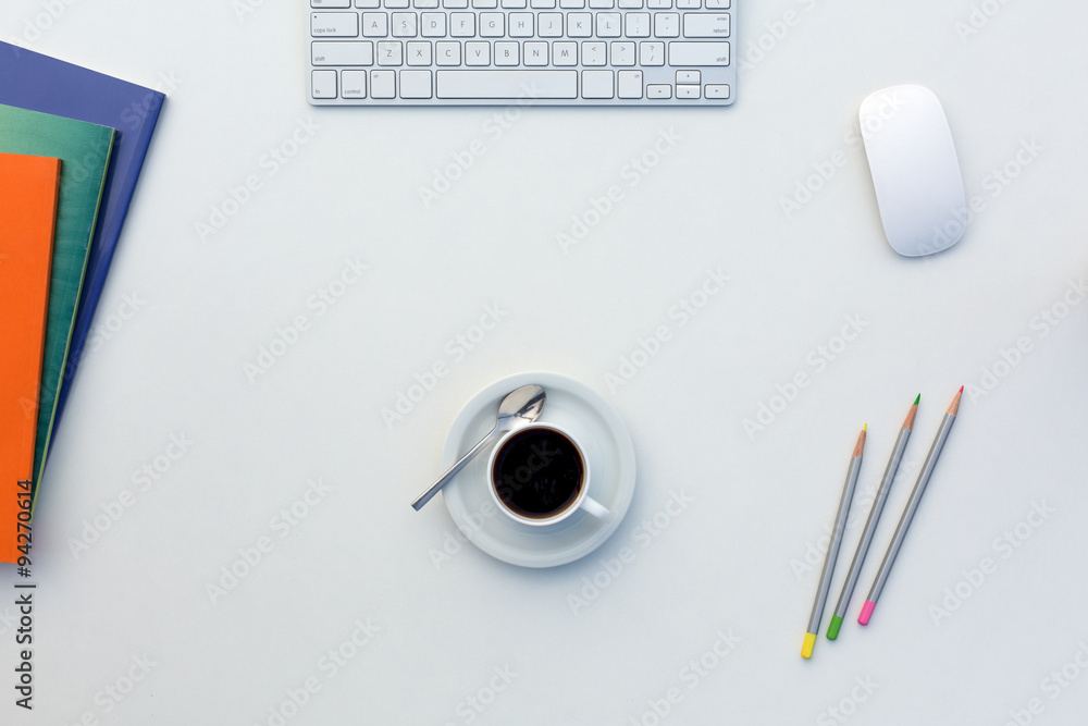 Creative Office Bright Table with Color Magazines and Pencils Computer and Coffee Mug Creative Office Bright Table with Color Magazines and Pencils Computer and Coffee Mug