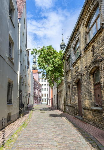 Fototapeta Naklejka Na Ścianę i Meble -  Medieval street in old Riga city, Europe. In 2014, Riga was the European capital of culture