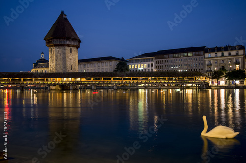 Cityscape of Lucerne old town with the famous chapel bridge and Reuss river at night