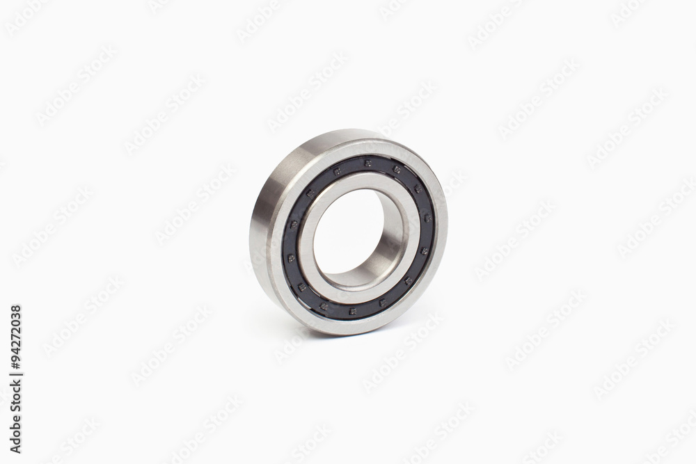 Close-up bearings spare part of mechanical on the white background. Close-up bearings spare part of mechanical on the white background.