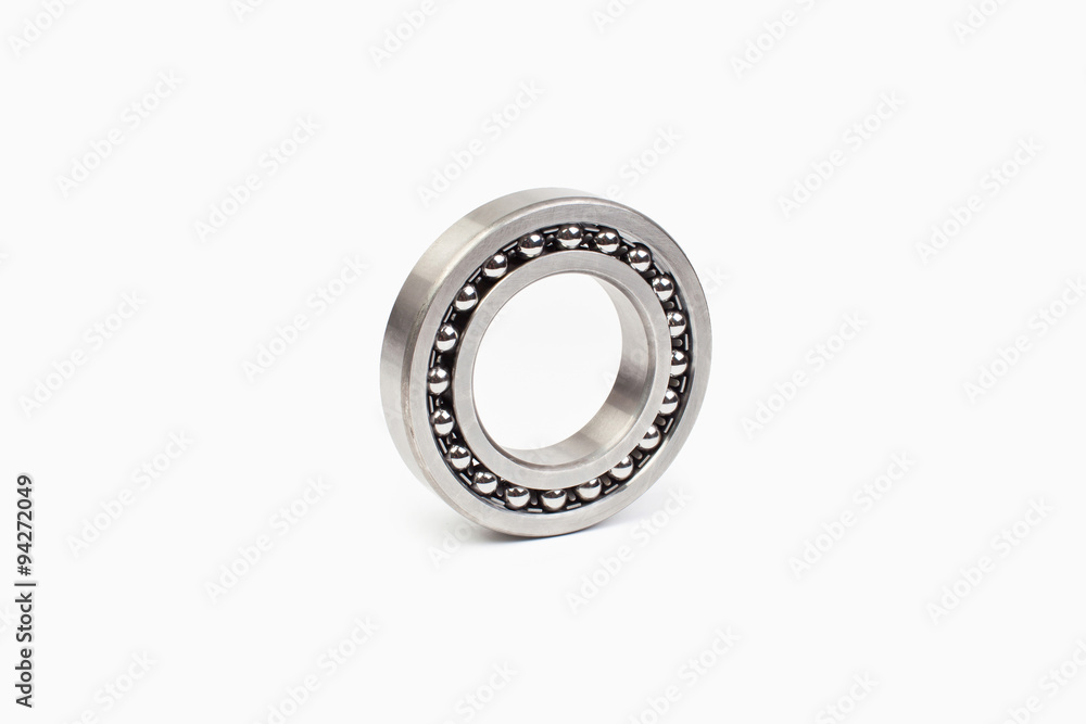 Close-up bearings spare part of mechanical on the white background. Close-up bearings spare part of mechanical on the white background.
