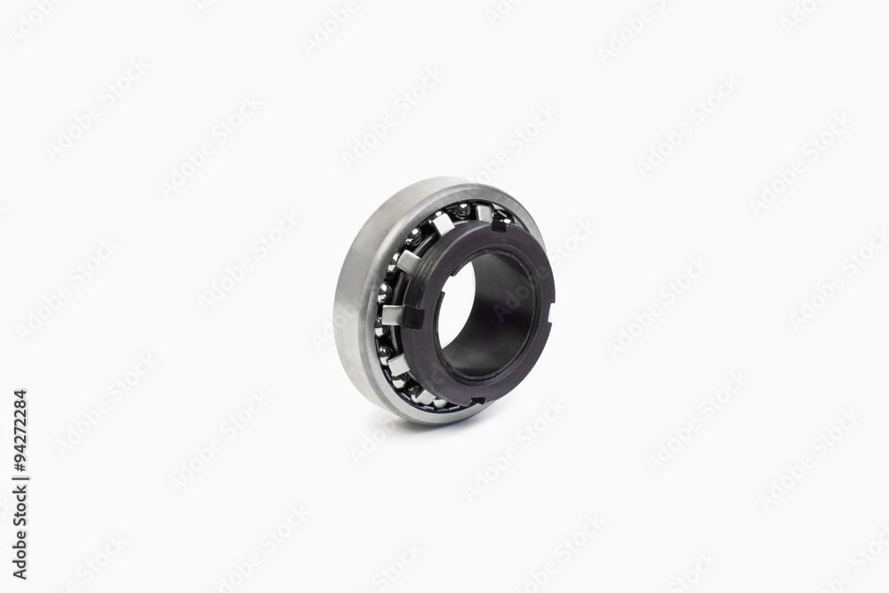 Close-up bearings spare part of mechanical on the white background. Close-up bearings spare part of mechanical on the white background.