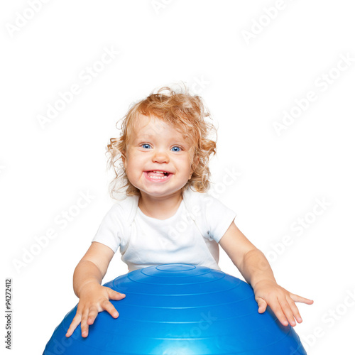 sportive baby playing with fitness ball.