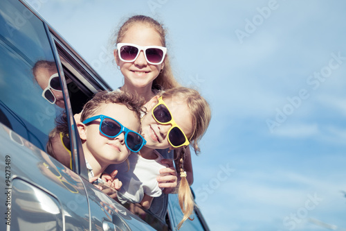Happy children getting ready for road trip on a sunny day © altanaka