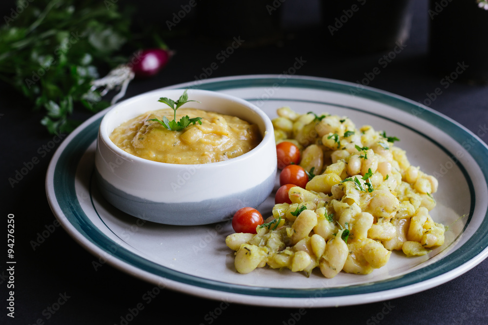 white beans and beans soup, with cherry tomato, and curcuma. white beans and beans soup, with cherry tomato, and curcuma.