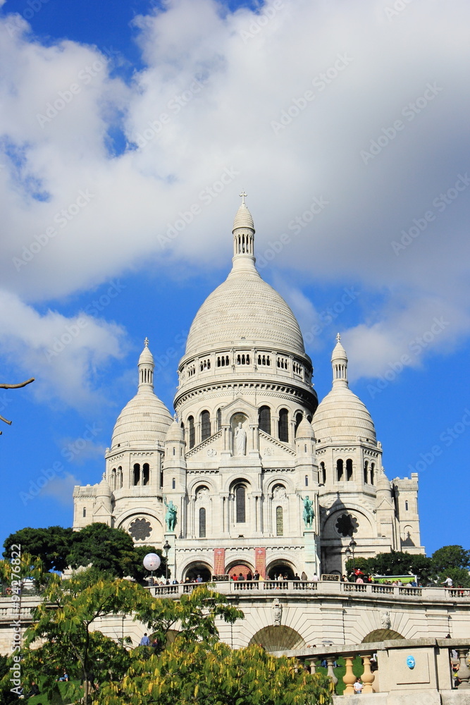 Basilica of the Sacre Coeur,Paris,France on cloud sky background Basilica of the Sacre Coeur,Paris,France on cloud sky background