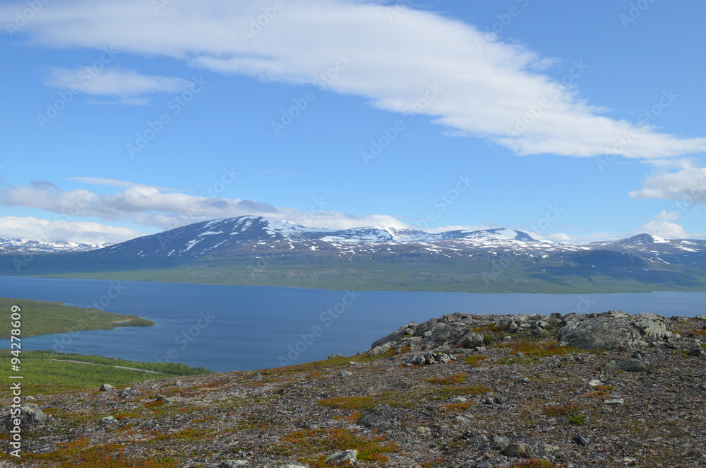 Rocks on top of mountain overlooking lake Torneträsk