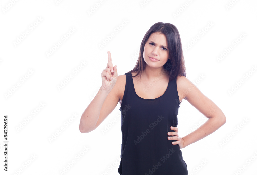 serious and interrogative young beautiful girl pointing up serious and interrogative young beautiful girl pointing up