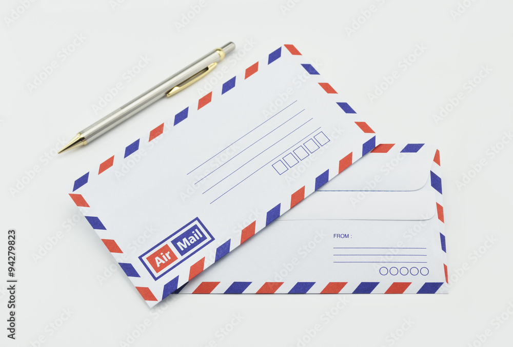 Stack of air mail envelopes and pen on white Stack of air mail envelopes and pen on white