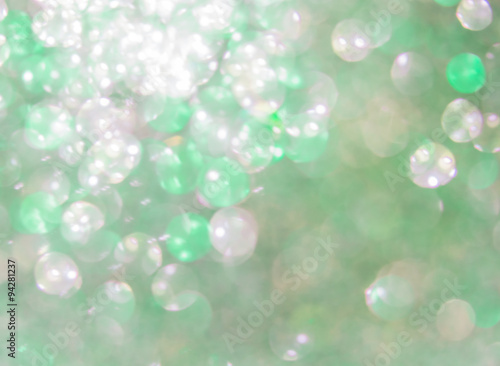 Holiday abstract green glitter defocused background with blinkin