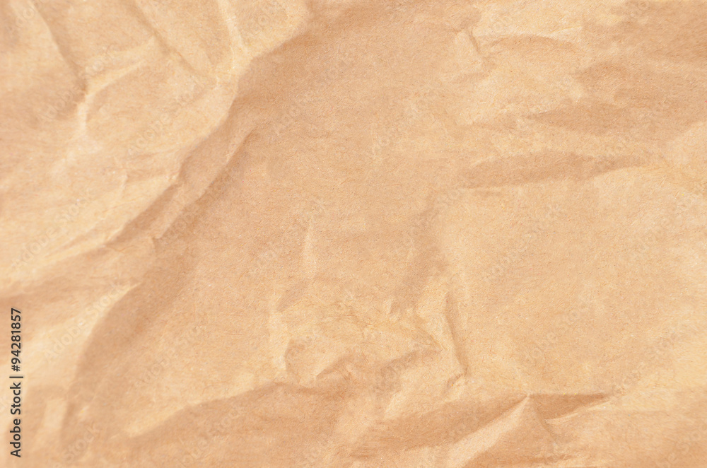 Fototapeta premium Wrinkled packaging paper background, close up, DOF