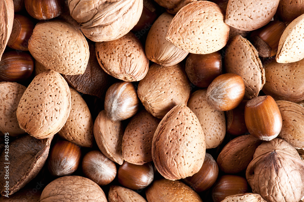 Mixed nuts on a wooden background Mixed nuts on a wooden background